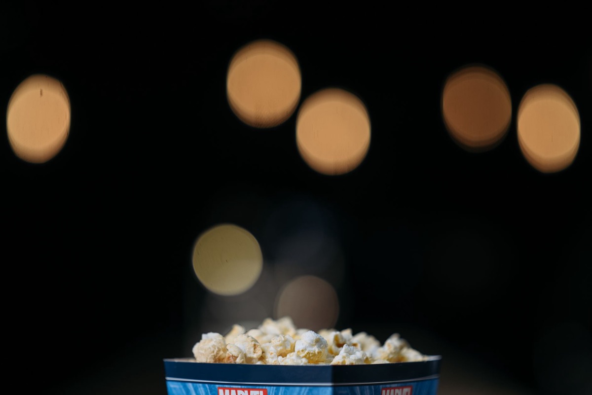 Classic cinema snacks including popcorn and a soft drink.