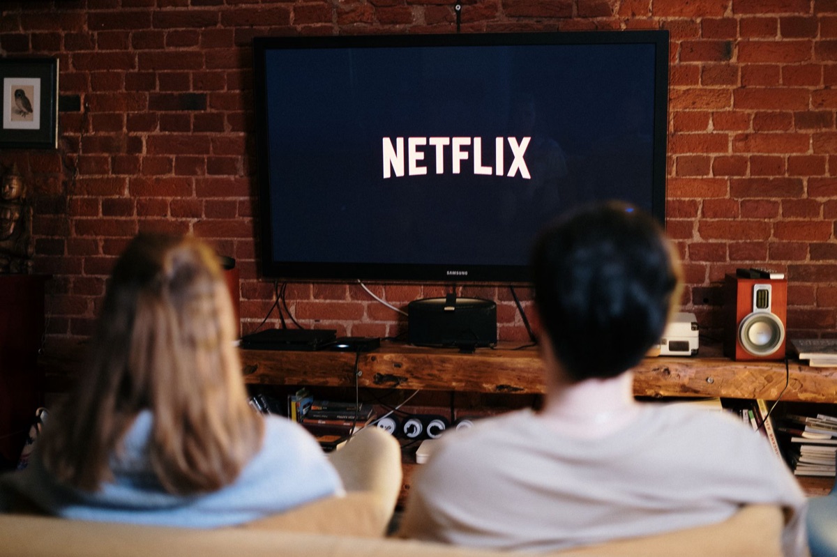 A modern living room with a large television screen ready for streaming